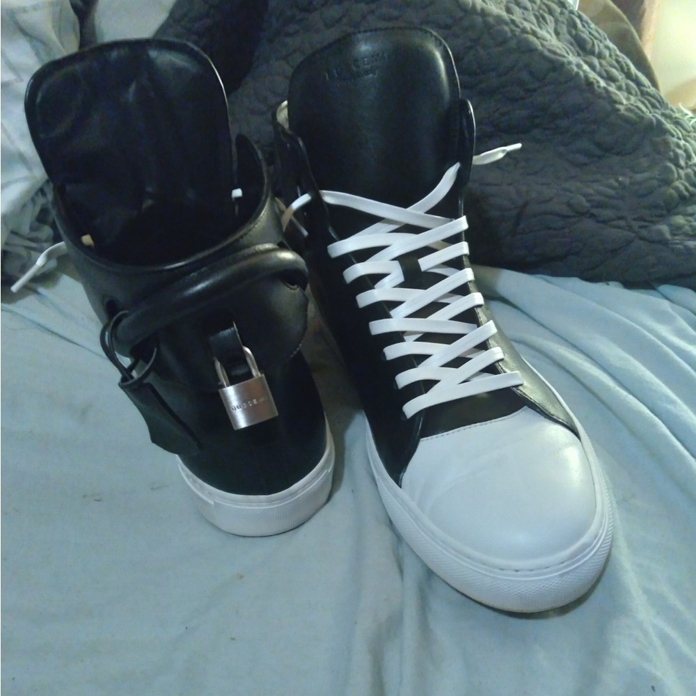 Buscemi hightop with chrome locks on back of sneakers